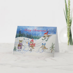 Weihnachtseulen, die im Schnee spielen Feiertagskarte