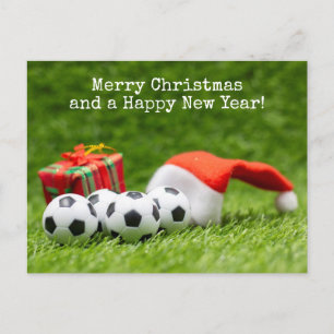 Weihnachtsfeiertag mit Weihnachtsmannmütze und Ges Feiertagspostkarte
