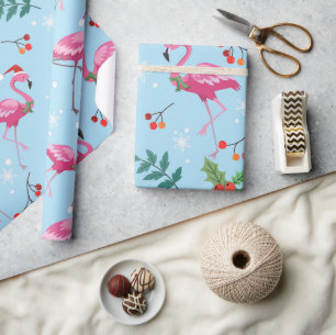 Weihnachtsflamingos und Stechpalme auf blauem Must Geschenkpapier