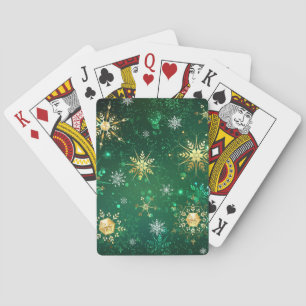 Weihnachtsgoldschneeflocken auf grünem Hintergrund Spielkarten