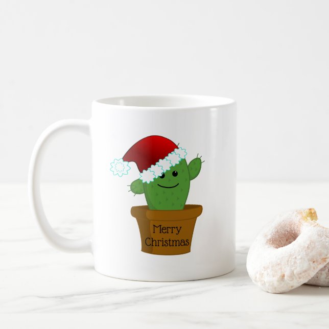 Weihnachtskaktus in einer Weihnachtsmannmütze Kaffeetasse (Mit Donut)