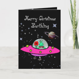 Weihnachtskarte mit Alien in einem Raumschiff und Feiertagskarte