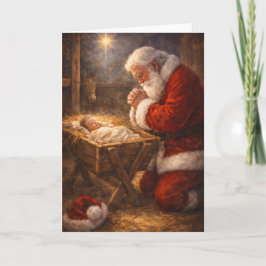 Weihnachtskarte mit kniendem Santa am Krippe Feiertagskarte