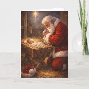 Weihnachtskarte mit kniendem Santa am Krippe Feiertagskarte