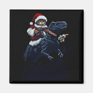 Weihnachtskatze in Santa-Hut hält eine Waffe und D Magnet