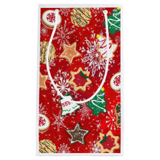 Weihnachtskekse und Schneeflocken auf Rot Kleine Geschenktüte