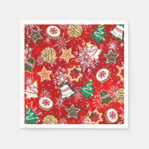 Weihnachtskekse und Schneeflocken auf Rot