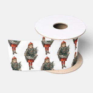 Weihnachtsmädchen und Stechpalmenbeeren im Vintage Satinband