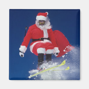 Weihnachtsmann auf dem Skispringen weg von einem Magnet