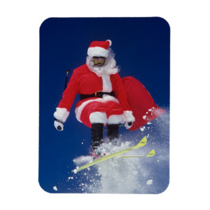 Weihnachtsmann auf dem Skispringen weg von einem Magnet