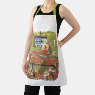 Weihnachtsmann mit Elfen in der Werkstatt Schürze