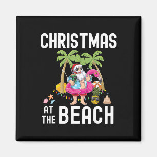 Weihnachtsmann surft auf Palme im Sommer Magnet