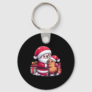 Weihnachtsmann umarmt Niedliches Capybara mit S Schlüsselanhänger