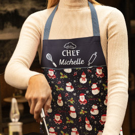 Weihnachtsmann und Schneemänner feiern Weihnachten Schürze