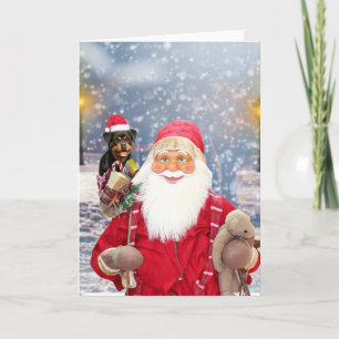 Weihnachtsmann und Weihnachtsgeschenke Rottweiler  Feiertagskarte