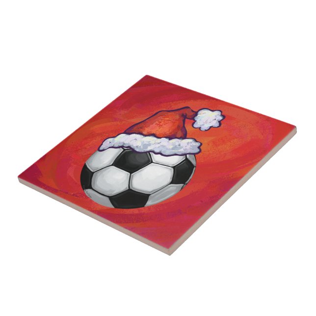 Weihnachtsmannmütze Fußball auf Rot Fliese (Seite)