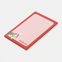 Weihnachtspinguin bekommt eine Schneeball Post-it Klebezettel