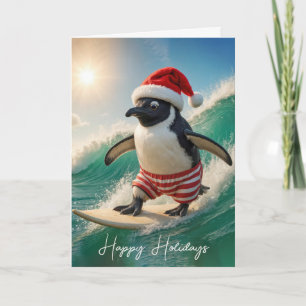 Weihnachtspinguin surft auf einer Welle Feiertagskarte