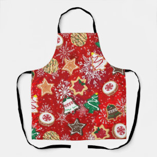 Weihnachtsplätzchen und Schneeflocken auf roter Sc Schürze