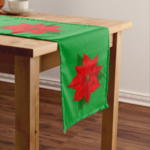 Weihnachtsrote Poinsettienblüten auf Grün Großer Tischläufer