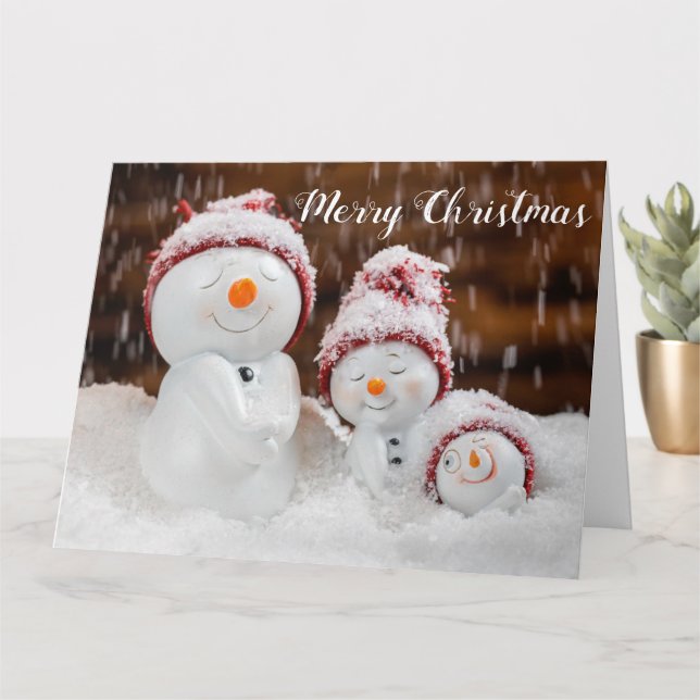 Weihnachtsschneefamilie Karte (Kleine Pflanze)