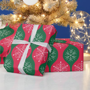 Weihnachtsschneeflocken auf retro grün roten Ogee Geschenkpapier