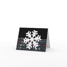 Weihnachtsschneeflocken und Blätter mit schwarzer 