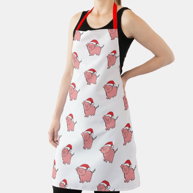 Weihnachtsschwein in der Weihnachtsmannmütze gemus Schürze (InSitu)