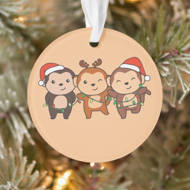 Weihnachtstiere der Affen Niedliche Affen oder Ornament (Baum)