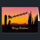 Weihnachtswüste<br><div class="desc">Eine Weihnachtskarte mit dem Weihnachtsmann,  der über die Wüste fliegt. In der Silhouette sind viele große Kakteen zu sehen. Wünschen Sie ein frohes Weihnachtsfest aus der Wüste mit einer schönen Sonnenuntergang farbenen Karte.</div>