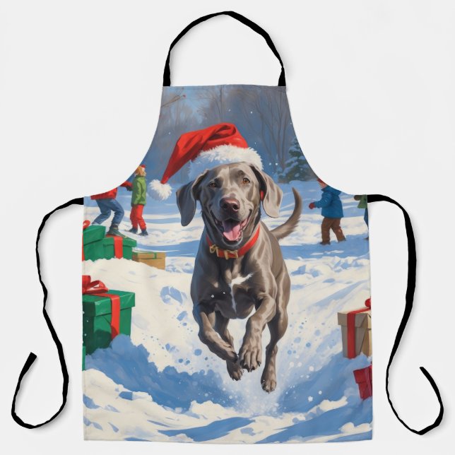 Weimaraner läuft im Schnee mit Weihnachtshut Schürze (Vorderseite)