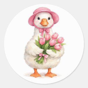 Weiße Gans hält rosa Tulpenstrauß Runder Aufkleber