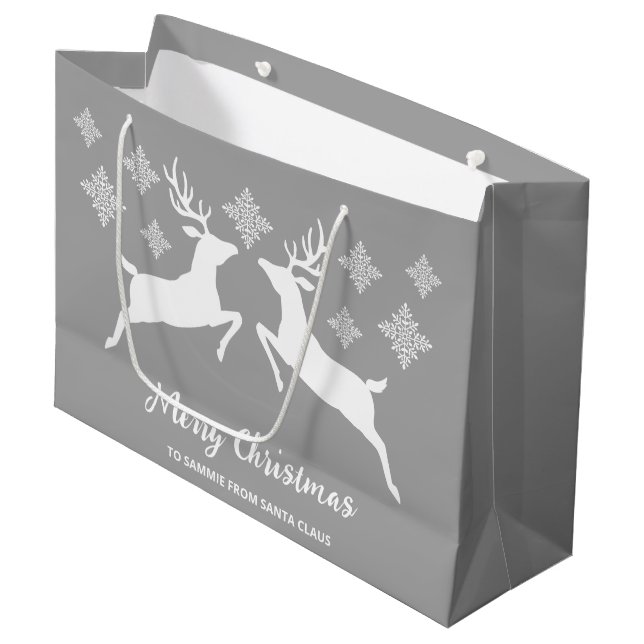 Weiße Hirschformen auf Grau mit Schneeflocken und  Große Geschenktüte (Vorderseite Schrägansicht)