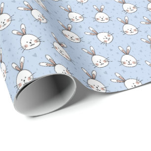Weiße Kaninchen auf blauem Geschenkpapier Ostern
