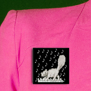 Weiße Katze auf Klaviertasten Button