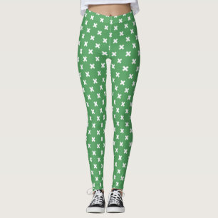 Weiße Kreuzstiche auf grün Leggings