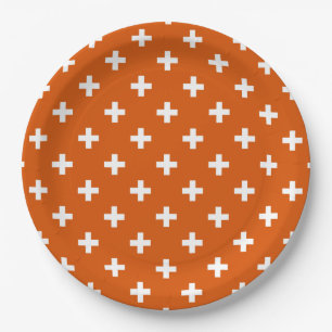 Weiße Polka-Kreuze auf verbrannter Orange Pappteller