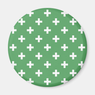 Weiße Polka kreuzt grün Magnet