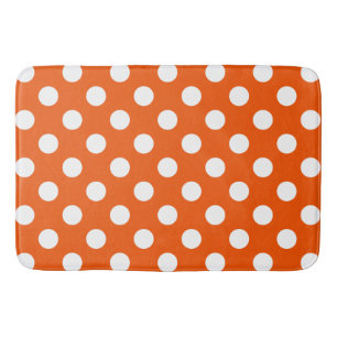 Weiße Polka-Punkte auf Orange Badematte