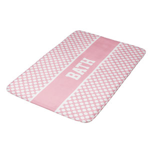 Weiße Polka-Punkte auf rosa Badematte