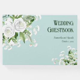 Weiße Rosen und Gipskraut auf blauen Hochzeiten Gästebuch