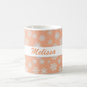 Weiße Schneeflocken auf einer Peach Background Kaf Kaffeetasse