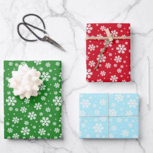 Weiße Schneeflocken im Winter auf grün rot und bla Geschenkpapier Set