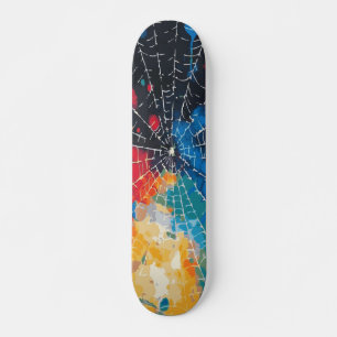 Weiße Spinnennetz auf mehrfarbiger Farbspritzer Skateboard