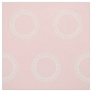 Weiße Tupfen-Ringe auf Baby-Rosa Stoff