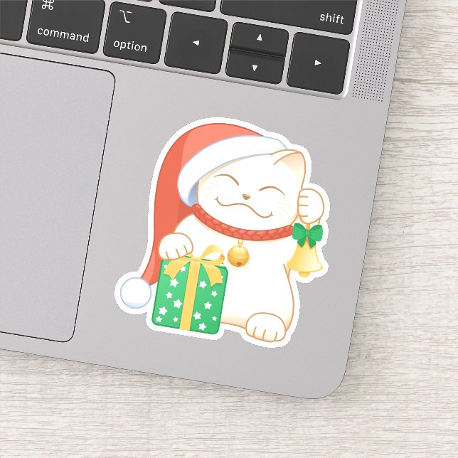 Weiße Weihnachtskatze in einem Red Hat Aufkleber (Detail)