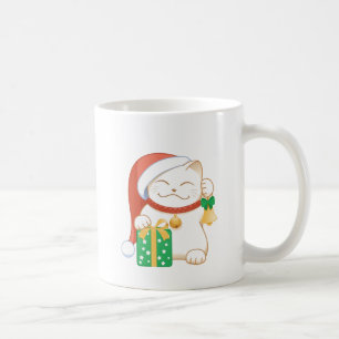 Weiße Weihnachtskatze in einem Red Hat Tasse