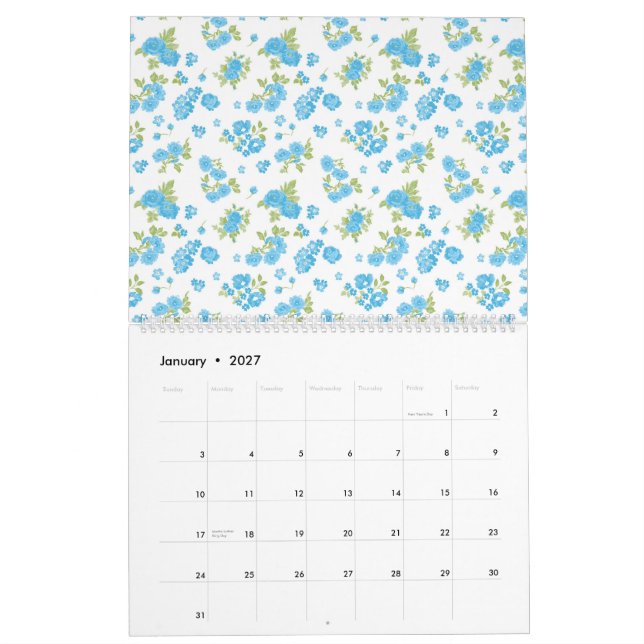 weißer Hintergrund mit blauen Blumen und grünem Le Kalender (Jan 2027)