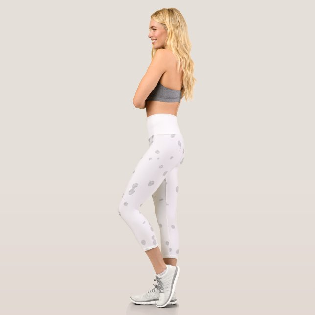 weißer Hintergrund mit vielen kleinen Punkten Capri Leggings (Links)