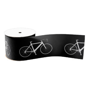 Weißes Fahrrad auf dem schwarzen Satin-Band Ripsband